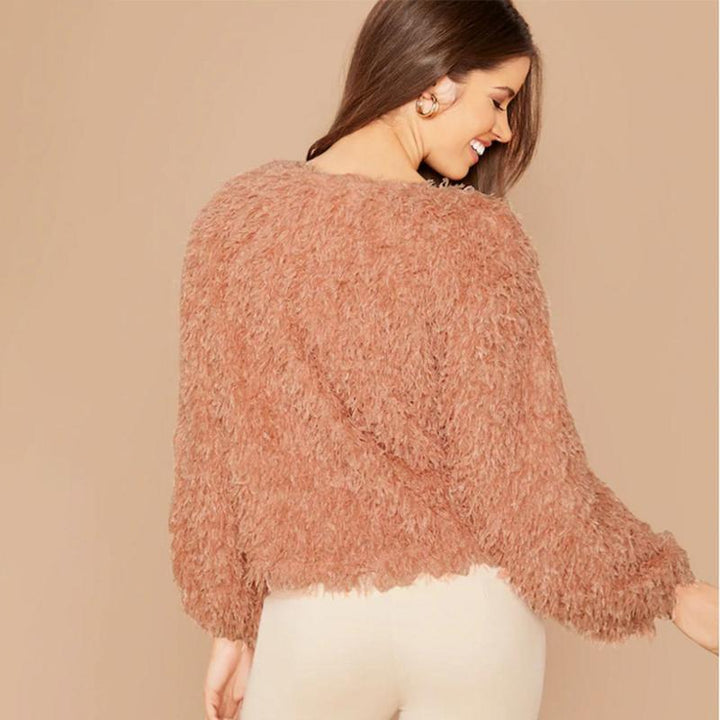 Luxuriously soft plush round neck sweater for women, offering warmth & cozy feel in winter fashion.
