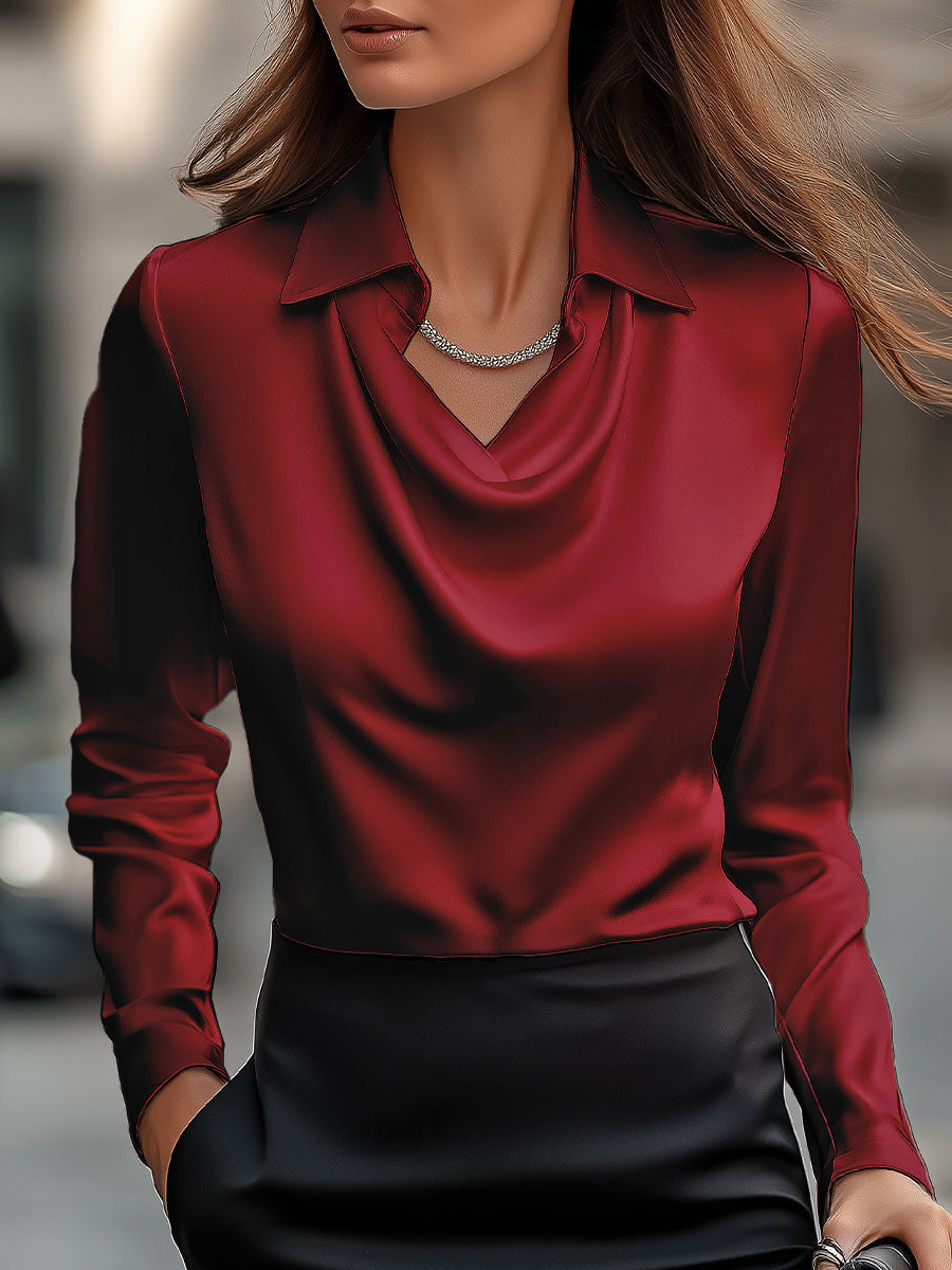 Refined women's formal blouse, featuring an elegant draped neck and smooth satin fabric.