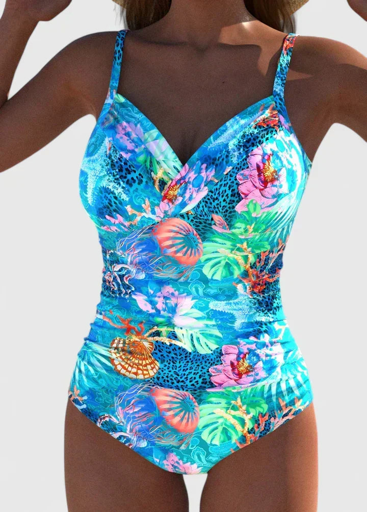 Women's luxury one-piece swimsuit with vibrant tropical print, perfect for beachwear & summer vacations.