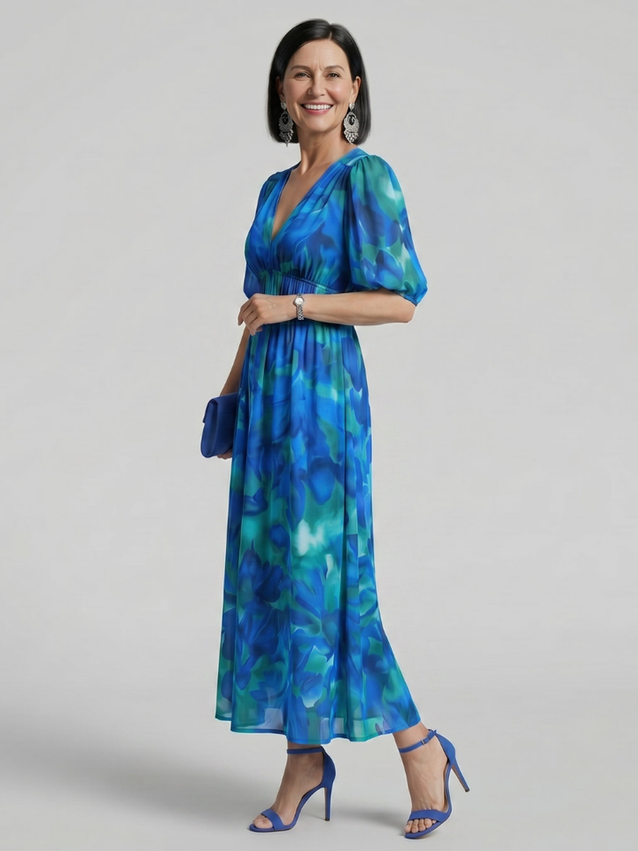 Stylish women's abstract print midi dress, featuring trendy puff sleeves and a chic V-neck. Perfect for casual wear.
