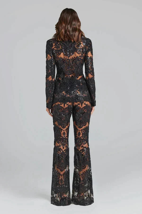 Sophisticated women's ensemble: a modern blazer and elegant flared trousers co-ord set for events.