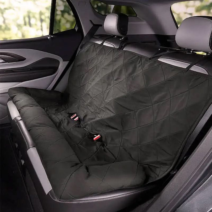 Quilted dog car seat cover for rear seats. Waterproof, anti-slip design ensures pet safety & vehicle protection.