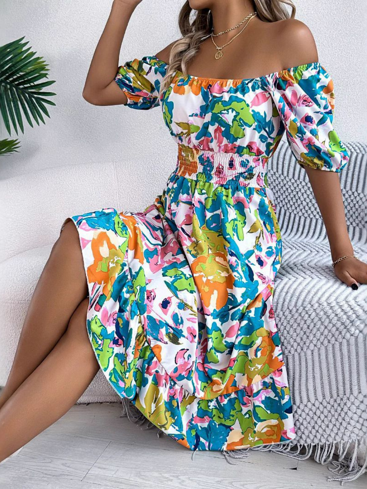 Boho style women's off-shoulder mini dress with smocked waist and floral print. A chic casual summer dress.