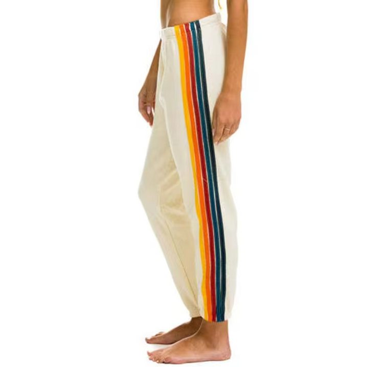 Colorful women's pants featuring a relaxed fit and fun rainbow stripes; ideal for casual everyday wear.