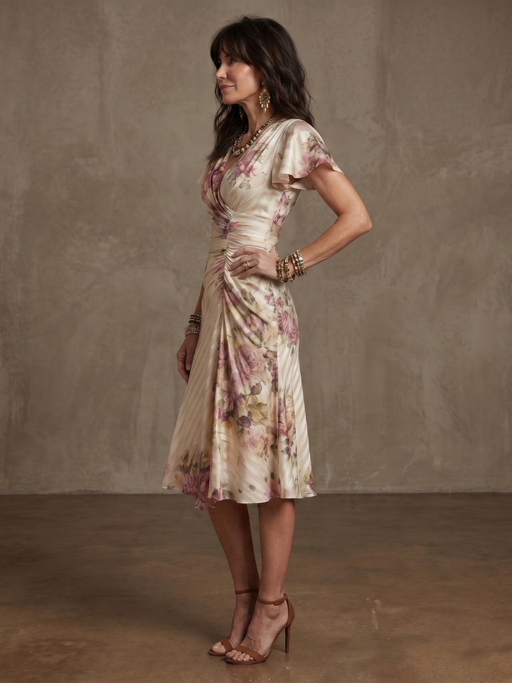 Feminine floral wrap ruched midi dress for women, ideal for summer parties & casual elegant wear.