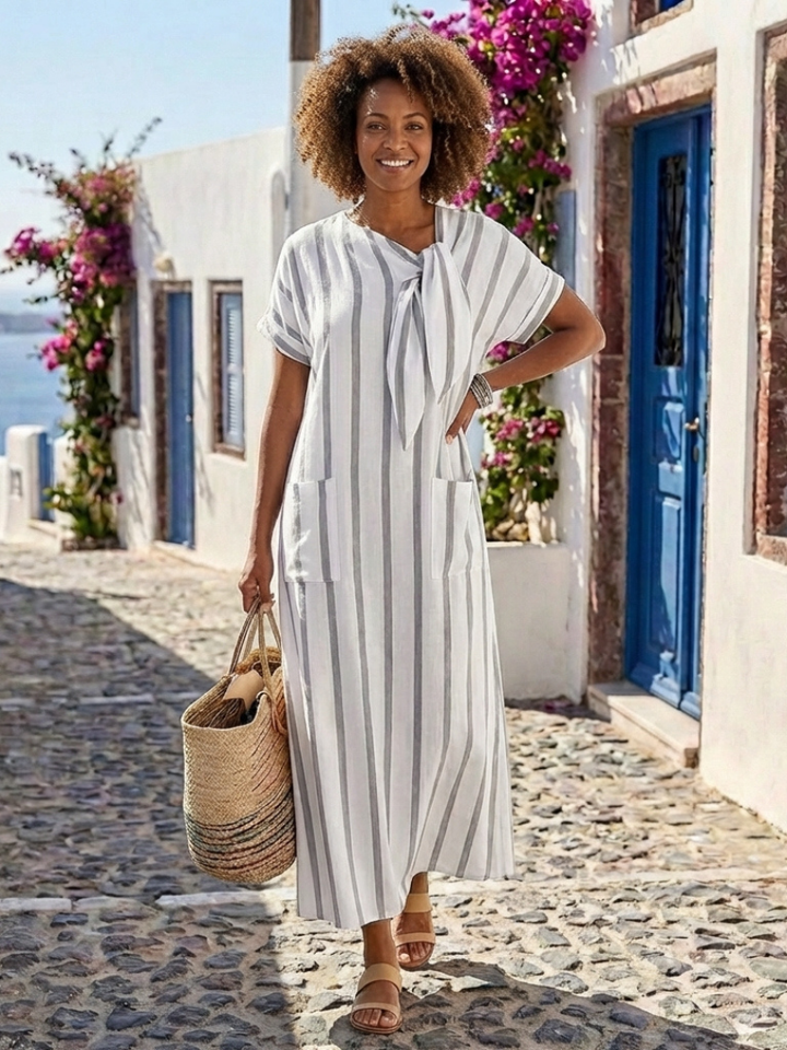Women's casual summer midi dress with a flattering striped print, tie neck, short sleeves & practical pockets.