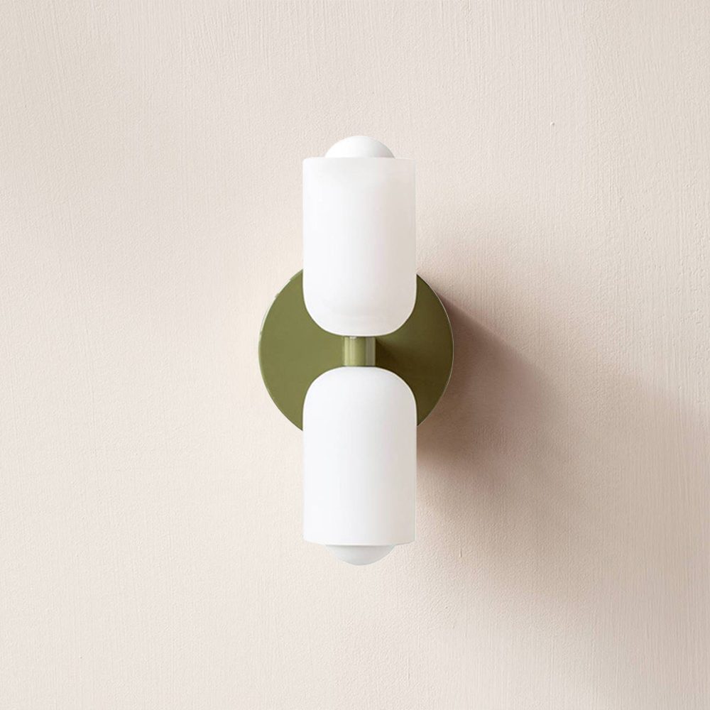 Modern interior lighting fixture, uplight downlight wall mount, soft ambient illumination.
