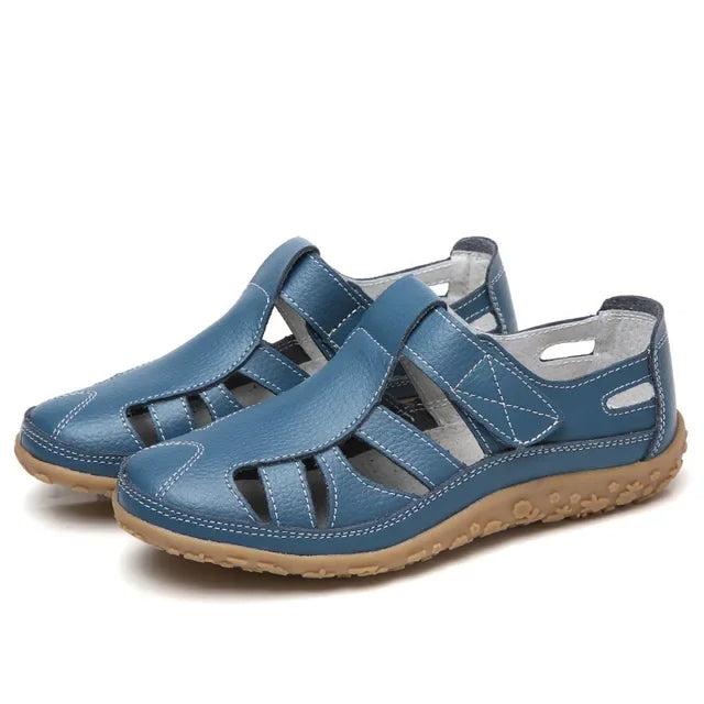 Women's brown leather comfort sandals with adjustable velcro straps & cushioned sole for summer walks.