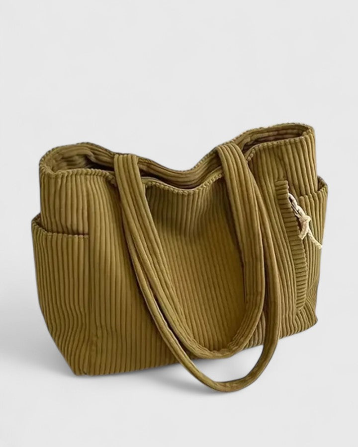 Elegant women's handbag: a chic corduroy tote for sophisticated everyday style & practicality.