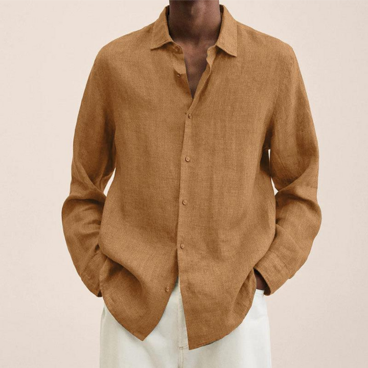 Smart casual men's long-sleeve button-up shirt, neatly tucked for a refined and polished appearance.