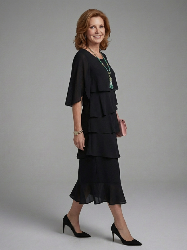 Comfortable & stylish women's Maelis relaxed fit black midi dress with flowing layered cape sleeves.