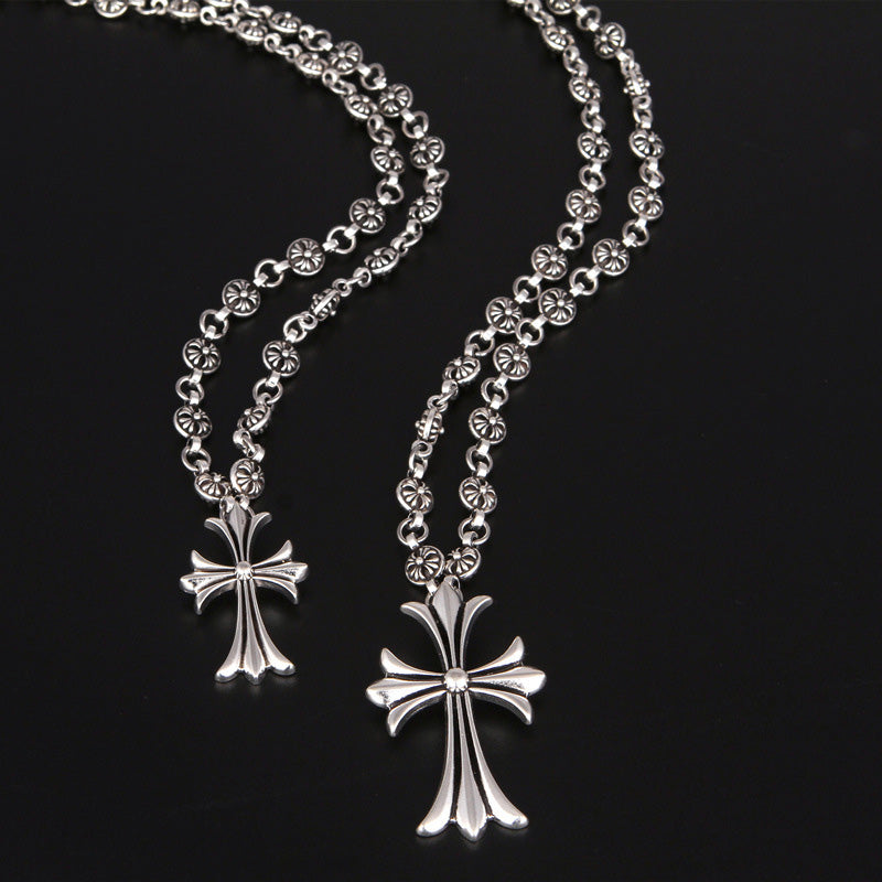 Unisex silver-tone Gothic cross pendant necklace, embodying Y2K punk and alternative style.