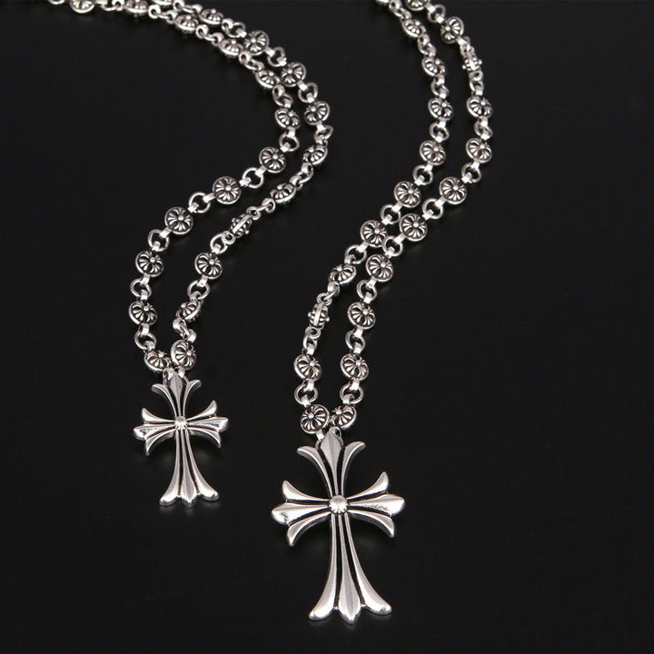 Unisex silver-tone Gothic cross pendant necklace, embodying Y2K punk and alternative style.