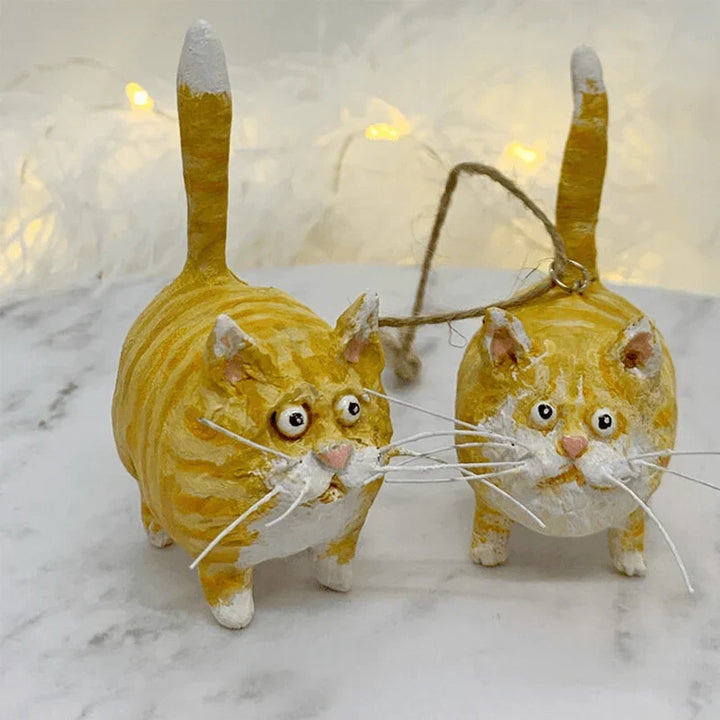 Close-up of a charming handmade cat ornament, designed for a unique Christmas tree decoration.