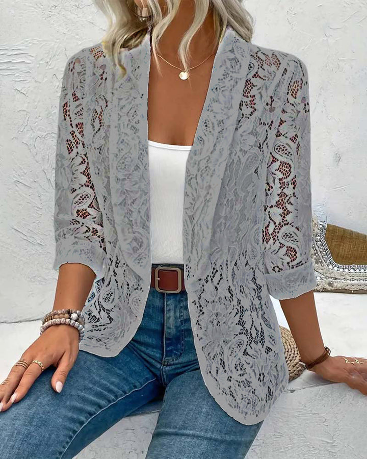 Classic elegant women's coat updated with a chic floral lace lapel collar, perfect for spring fashion.