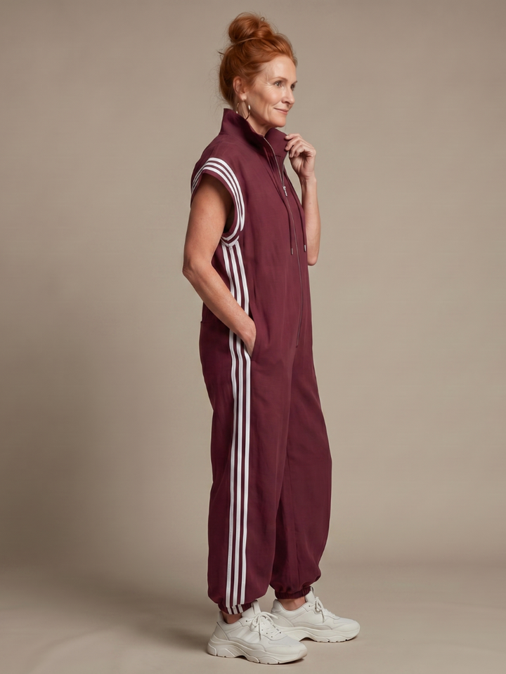Stylish women's full-length jumpsuit with a modern zip front and chic stripe panel design.