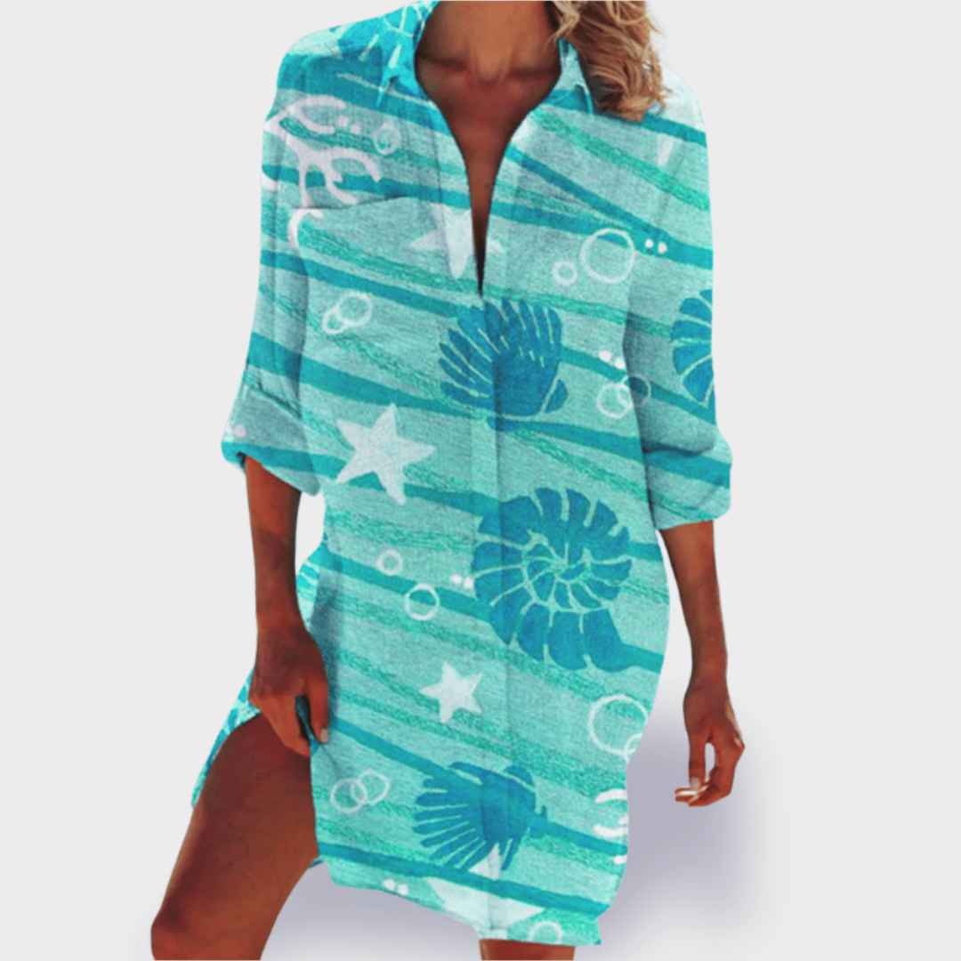 Women's summer dress, colorful and flowy, great for beach, vacation, or casual outing.