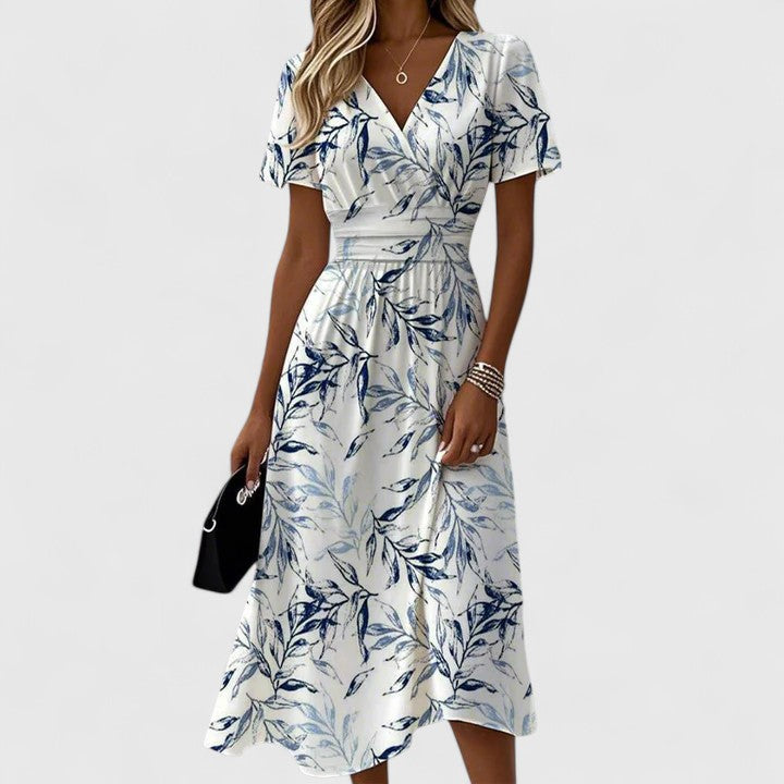 Stylish white floral wrap dress for women, offering a comfortable and flattering fit for any summer occasion.