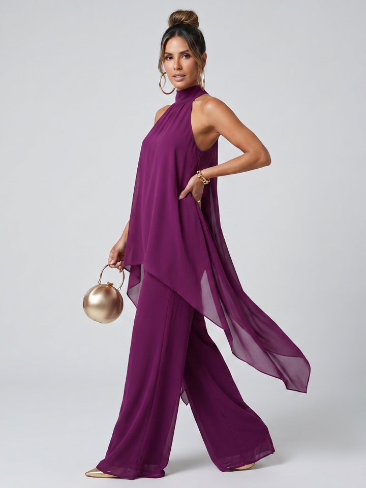 Women's fashion purple halter neck asymmetric tunic paired with wide leg pants. Casual chic two-piece set.
