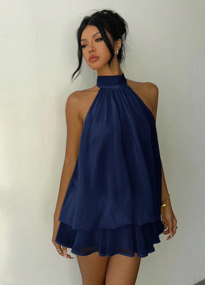 Sophisticated women's halter neck sleeveless mini dress with intricate tiered ruffle detailing.