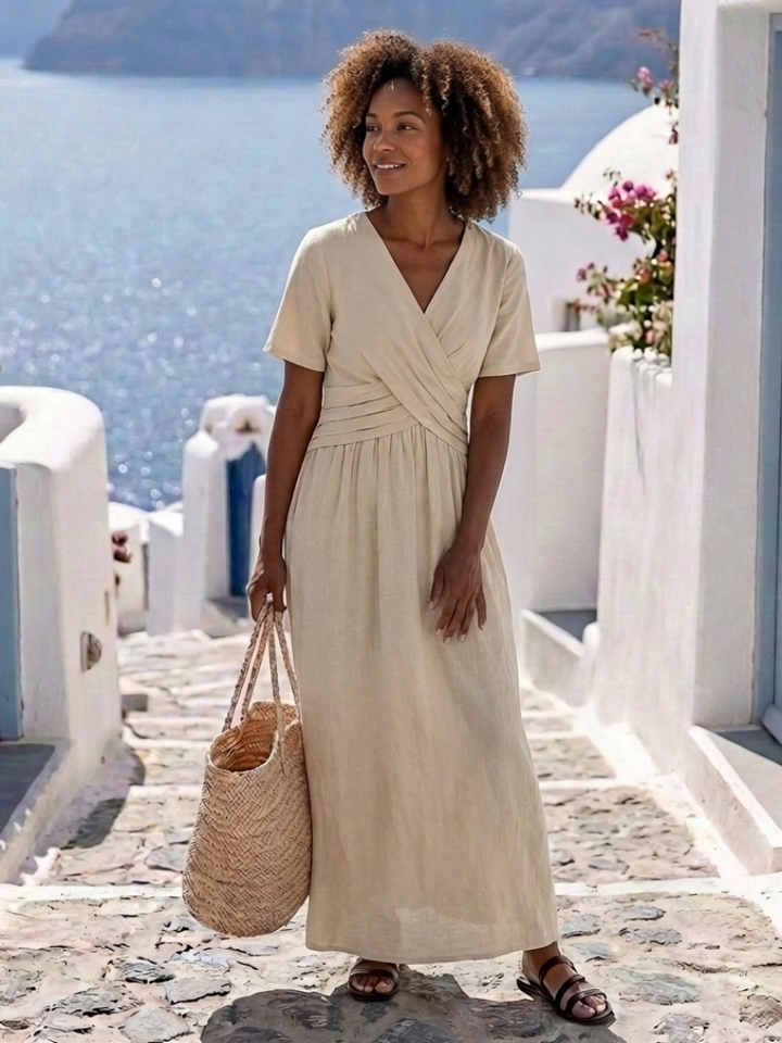 Comfortable women's beige V-neck short sleeve wrap midi dress, a versatile summer casual or elegant day dress.