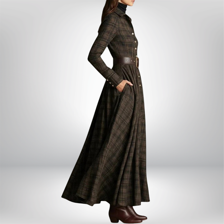 Close-up of a women's plaid midi shirt dress, showing the fabric detail, button front, and matching belt.