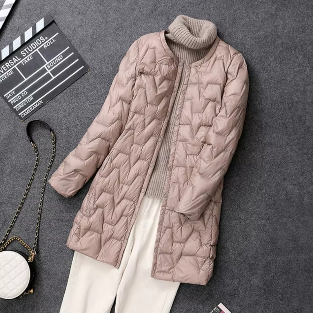 Stylish beige women's puffer jacket. Stay warm and chic with this elegant winter coat.