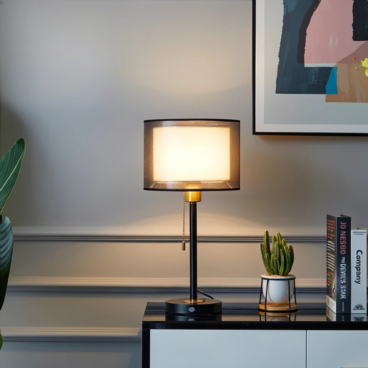 Stylish vintage metal base table lamp featuring a double fabric shade for soft, warm ambient LED light. E27 compatible.