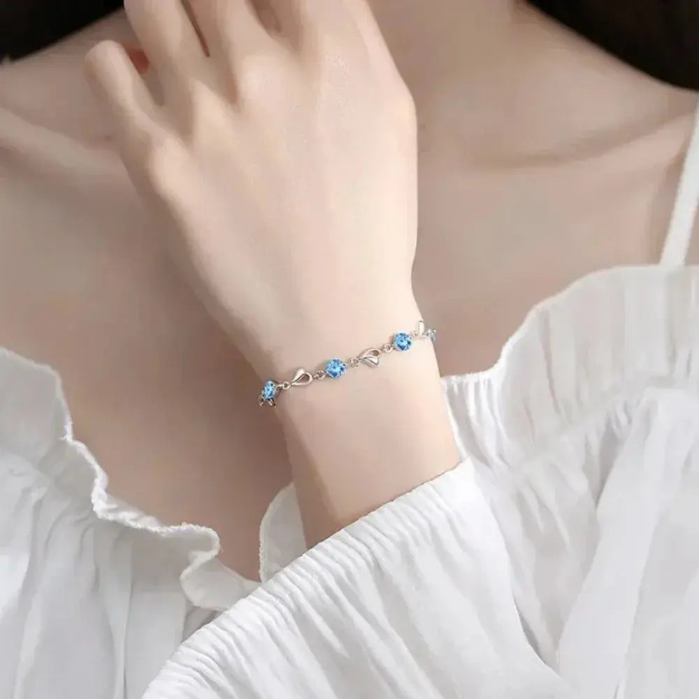 Premium 925 sterling silver heart jewelry set for women, includes delicate necklace and bracelet. Blue.