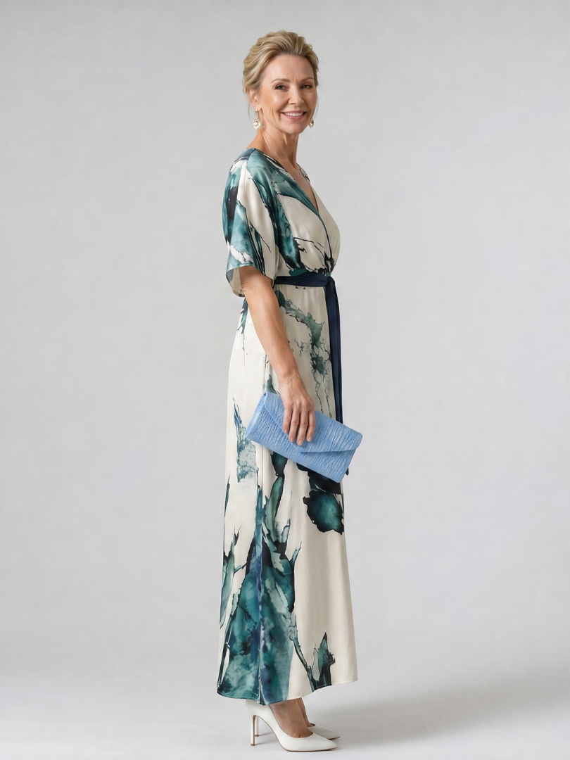 Elegant women's colorful abstract maxi dress with flutter sleeves & belted waist. Ideal for parties & summer occasions.