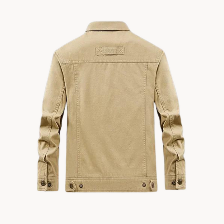 Close-up of durable fabric & secure fasteners on a men's versatile fall cargo jacket, highlighting quality.