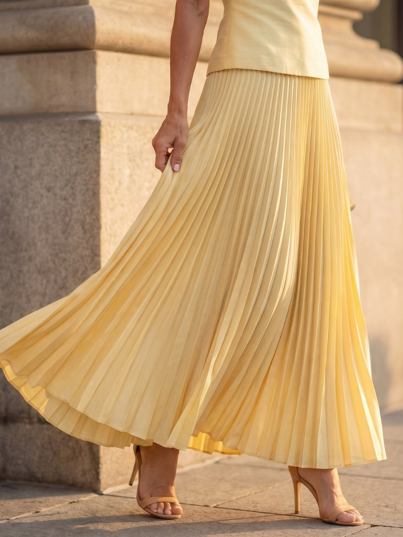 Sophisticated women's structured bodice and pleated skirt set, an ideal versatile outfit for summer events.