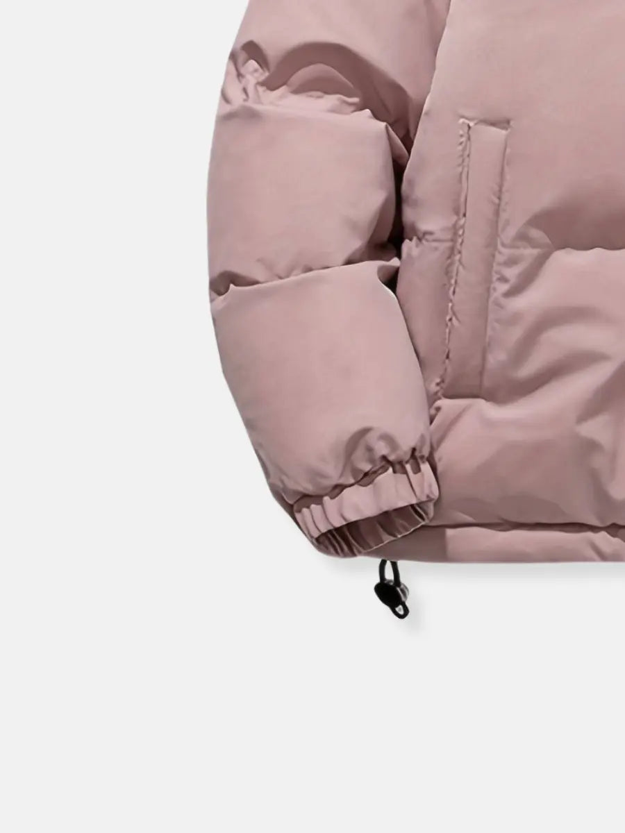Grey women's cold weather puffer jacket with a soft plush hood, perfect for casual comfort.