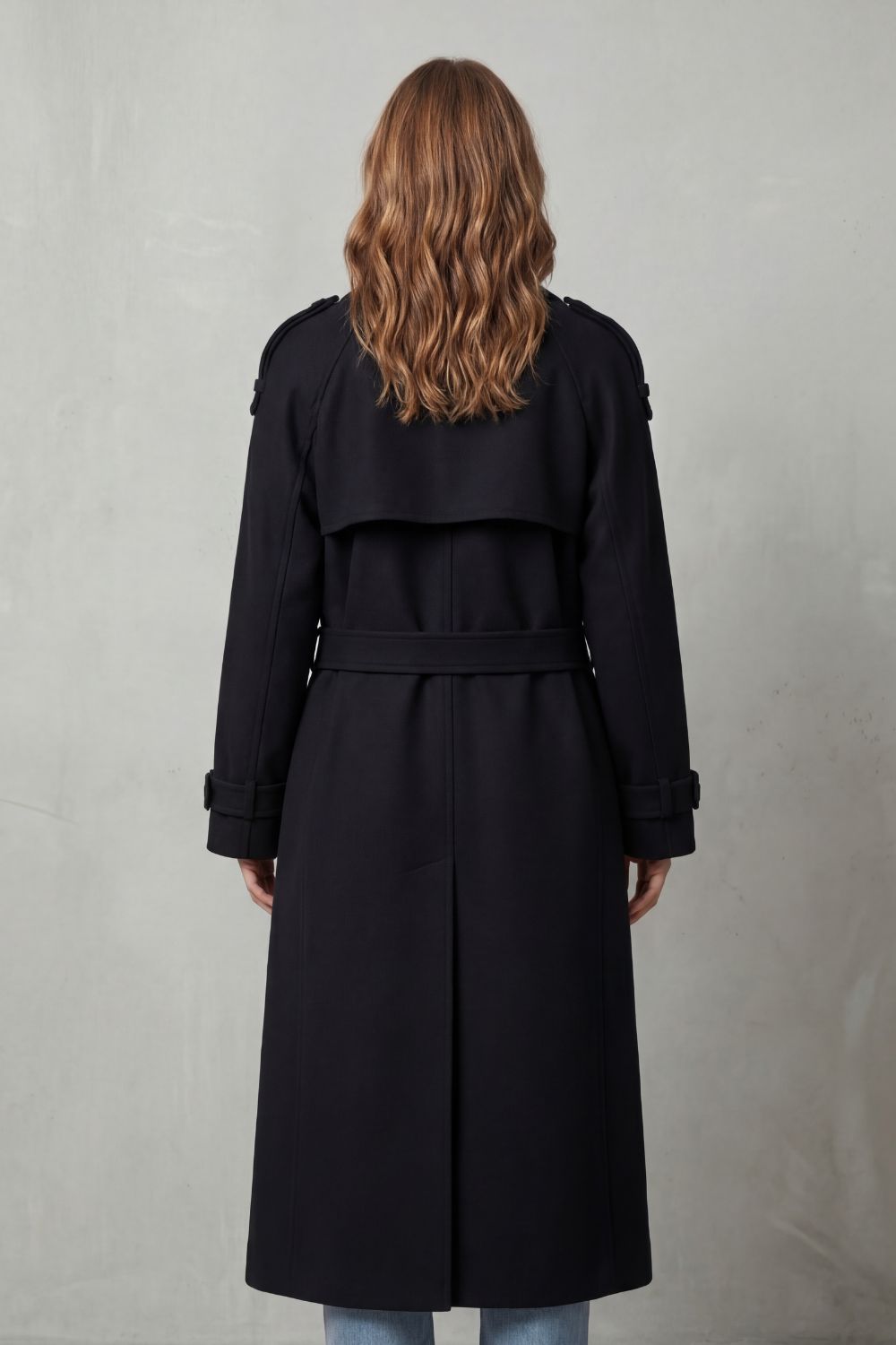 Elegant women's long trench coat, an oversized fashion jacket for chic autumn and winter layering style.