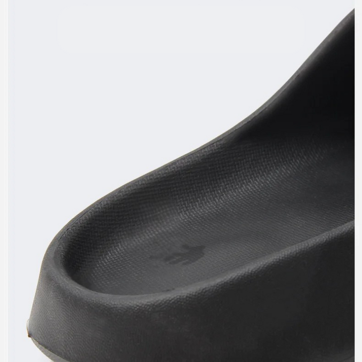 Ergonomic men's casual slip-on slippers, lightweight & comfortable for everyday wear.