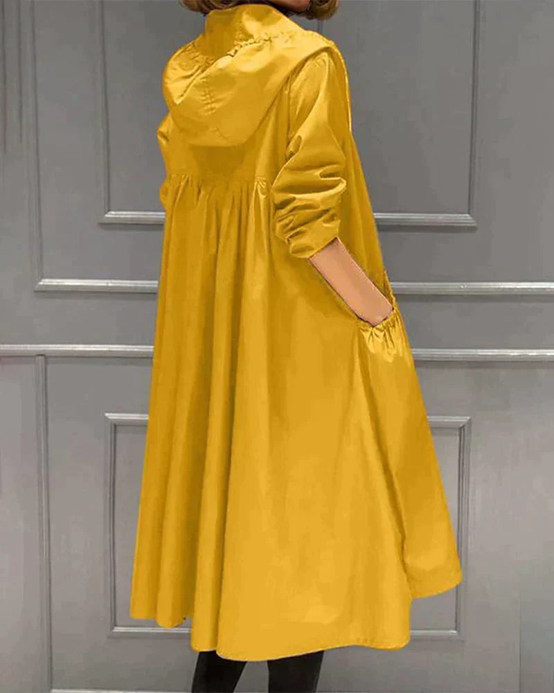 Women's sleek waterproof knee-length raincoat, providing stylish weather protection as chic outerwear.