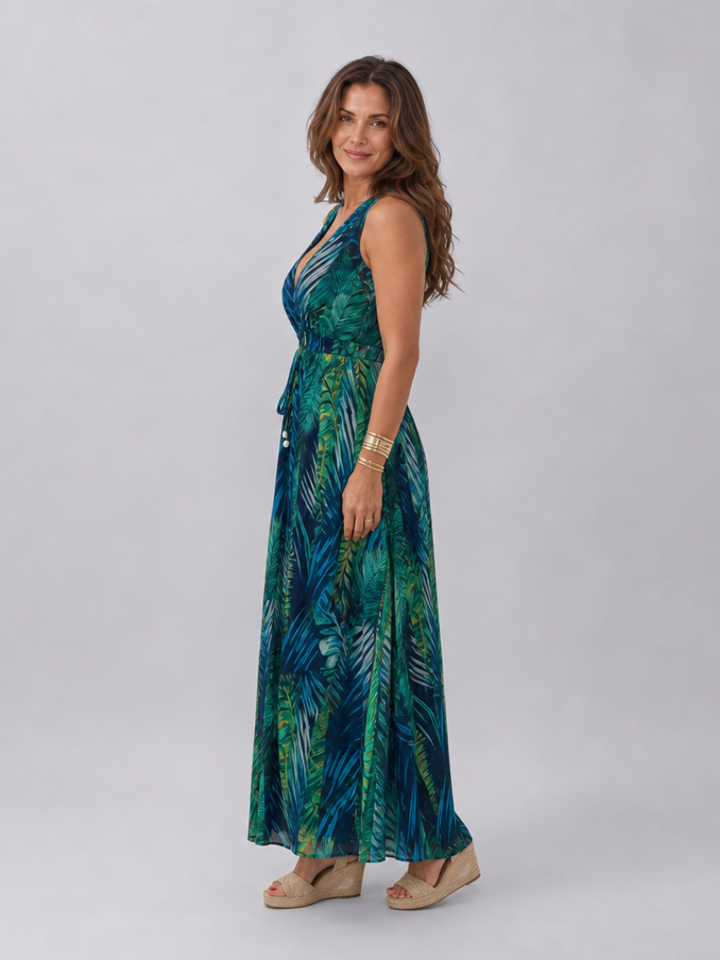 Elegant sleeveless empire waist midi dress for women, with a chic tropical print, ideal for casual summer fashion.