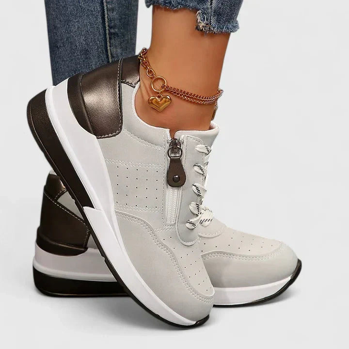 Women's supportive sneakers with arch support, designed for walking & active daily comfort, reducing foot fatigue.