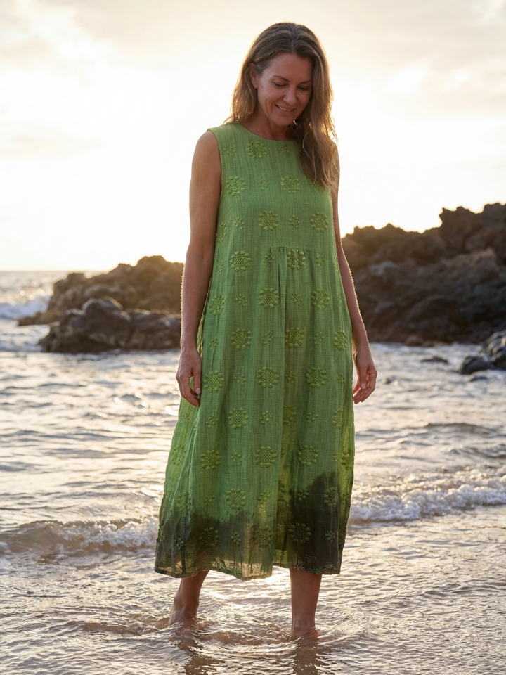 Comfortable women's textured garden midi dress in green. Sleeveless, relaxed fit for spring & summer casual wear.