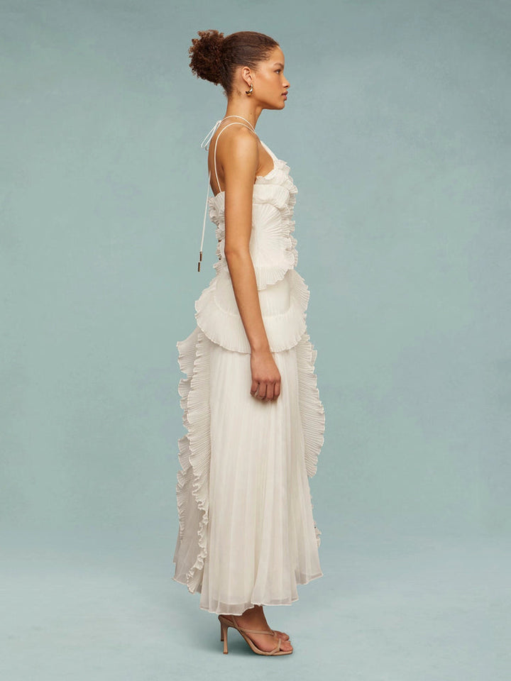 Perfect wedding guest dress: a sleeveless pleated maxi with unique asymmetric cut.