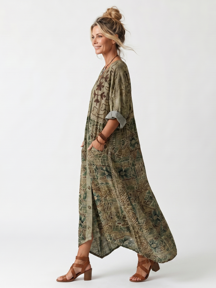 Embroidered v-neck midi dress for women, featuring a button front, pockets, and a comfortable, relaxed fit.