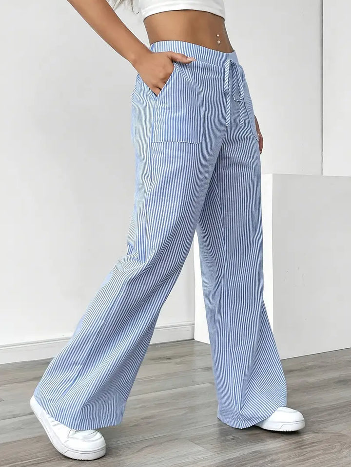 Elegant women's wide leg pants, fine stripes, side pockets, summer-ready.