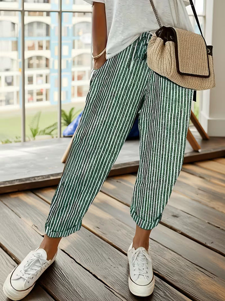 Fashionable women's wide-leg striped pants, offering effortless style & comfort for versatile casual wear.