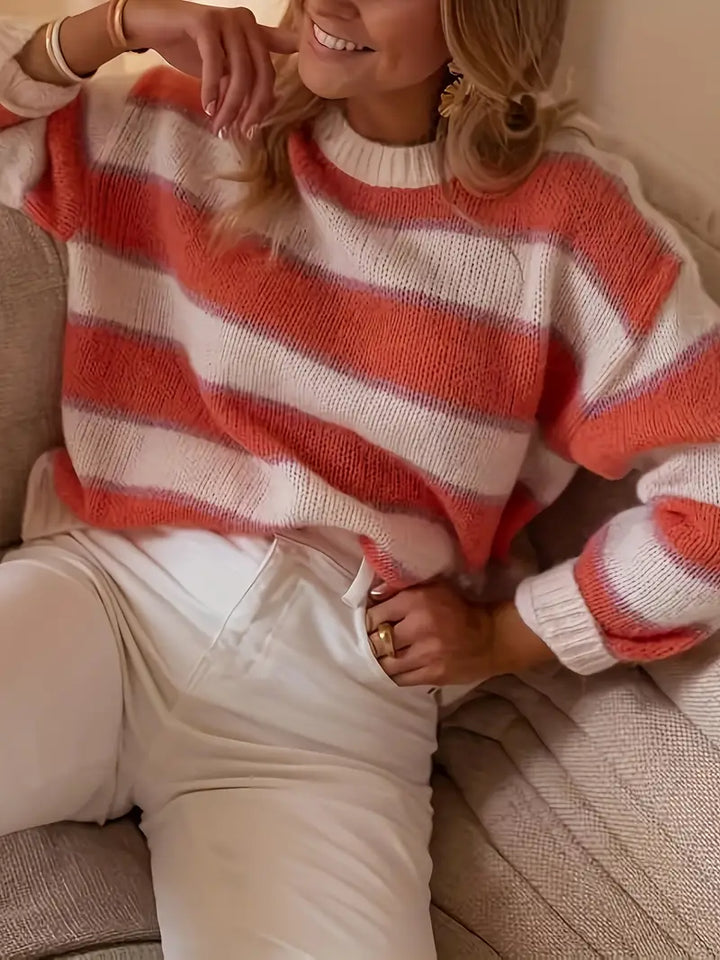 Blush pink striped knit jumper for women. Soft, comfortable long-sleeve sweater, perfect for casual winter fashion.