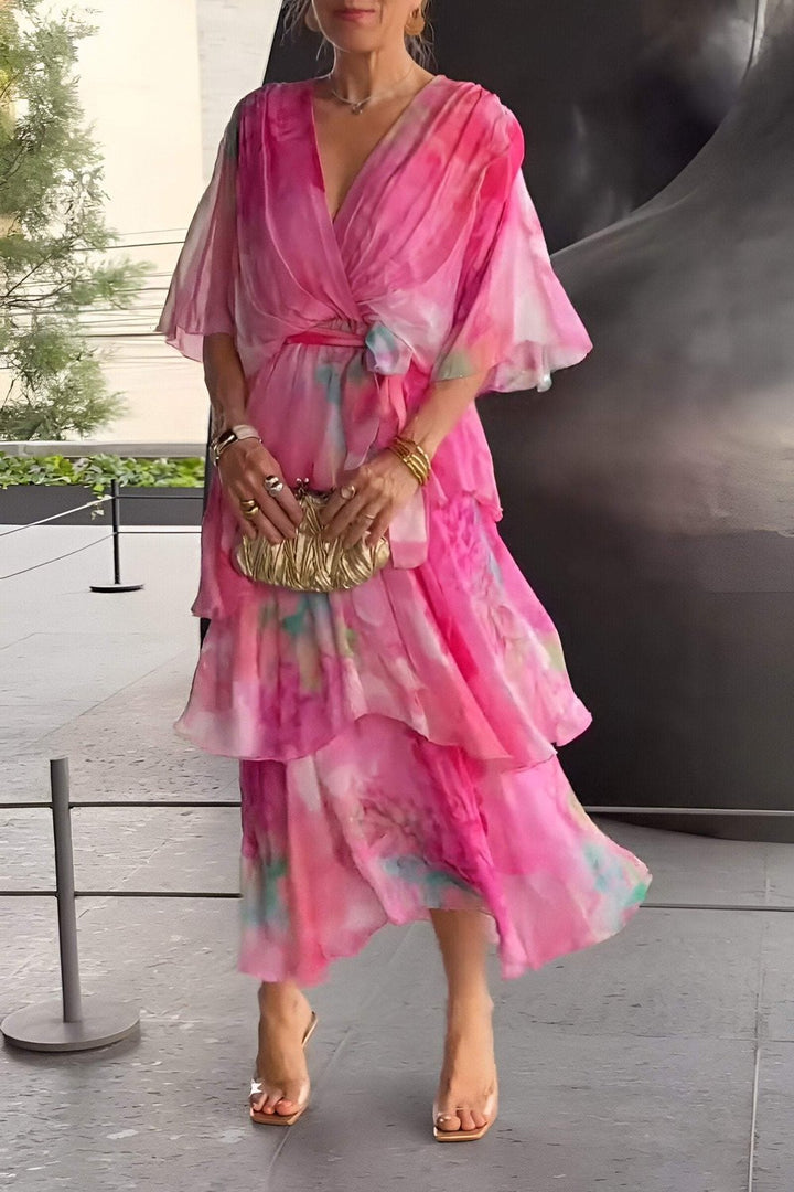 Stylish women's bohemian maxi dress with a layered, draped design. Versatile for day-to-night summer wear.