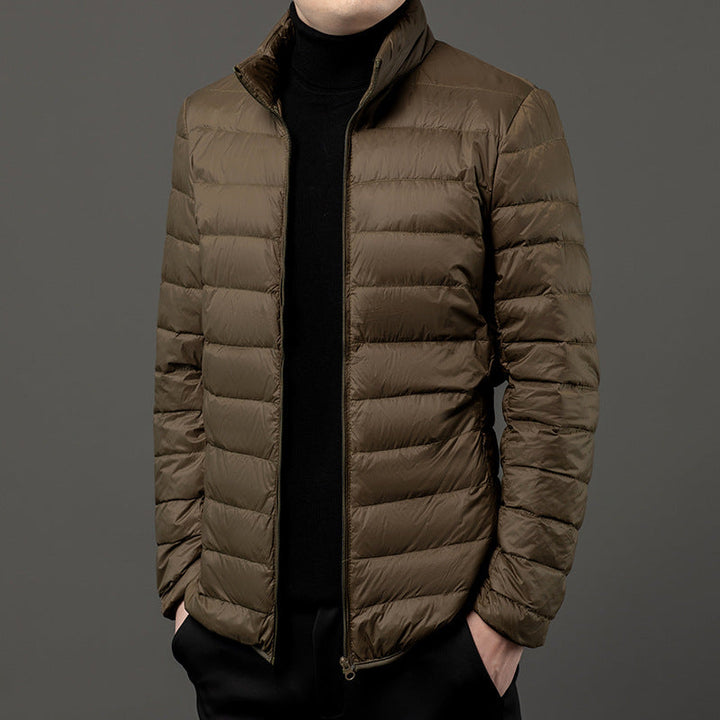 Men's slim-fit lightweight black puffer jacket, modern and warm, ideal for fall & winter casual outerwear.