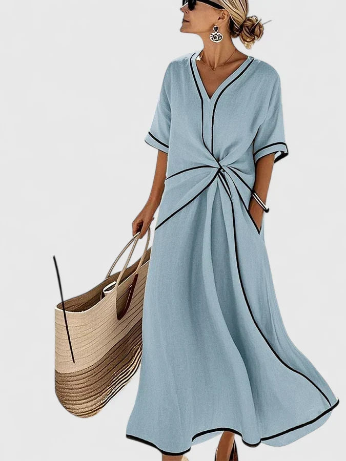 Comfortable women's striped summer dress, ideal for versatile everyday wear. Flowy fabric & elegant design.