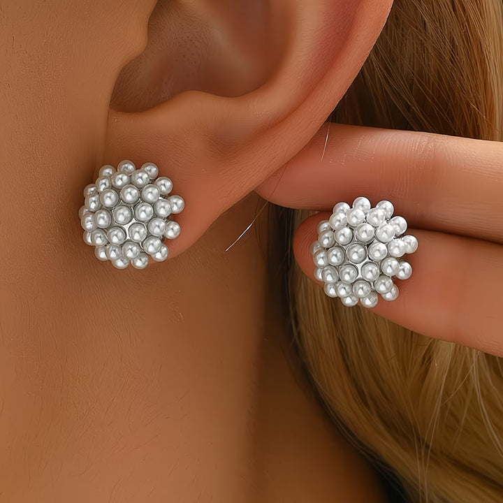 Elegant women's pearl dome stud earrings. Hypoallergenic fashion jewelry, perfect for a timeless look.