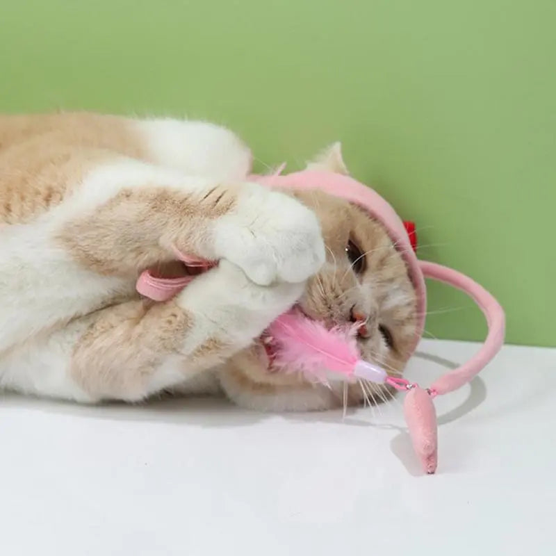 Playful cat hat with a dangling toy, an interactive pet accessory for endless fun.