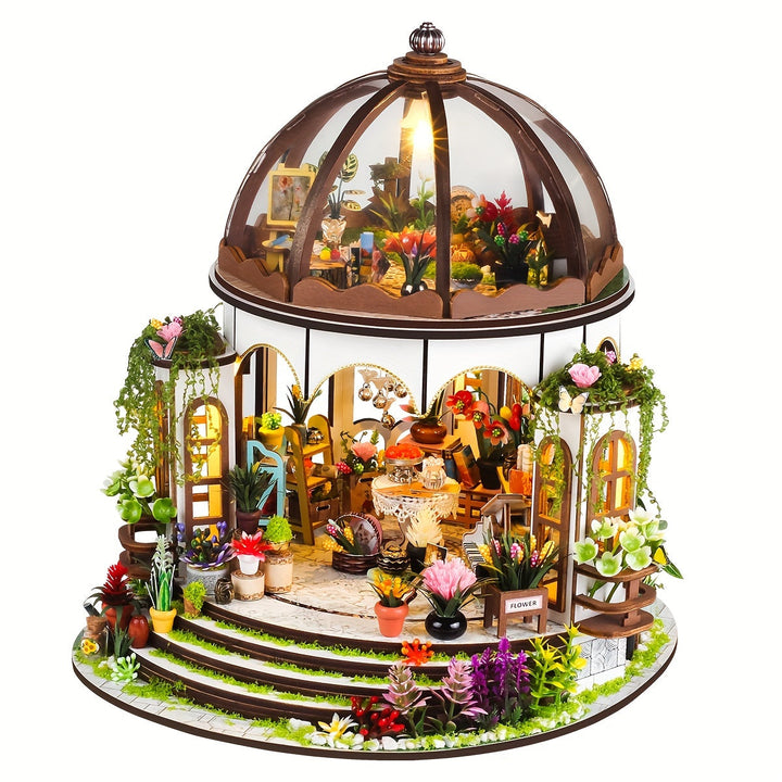 Assembled miniature flower house 3D wooden puzzle, displaying its detailed garden and LED lights.